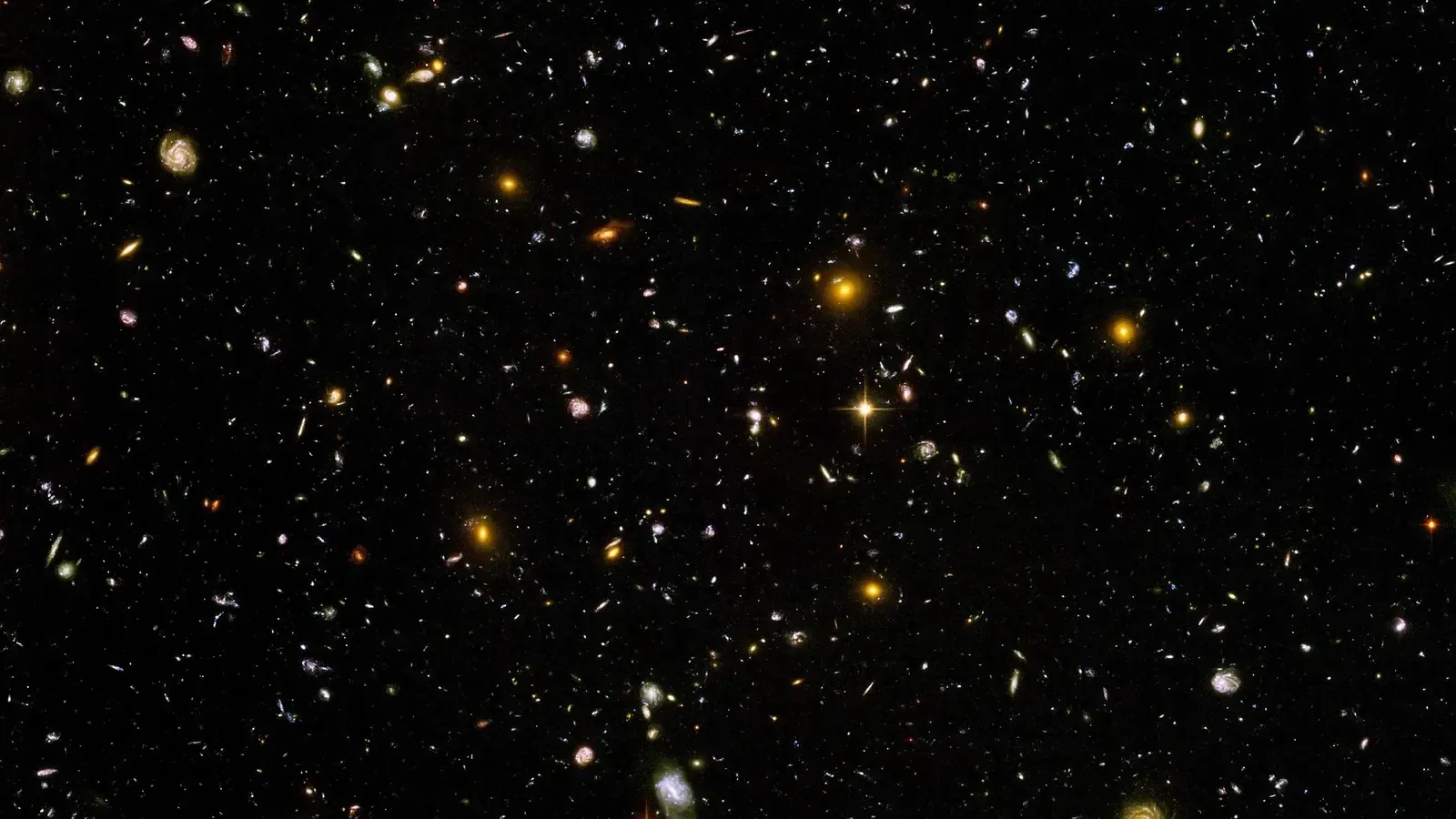 Thousands of galaxies of many shapes and colours in one small patch of dark sky